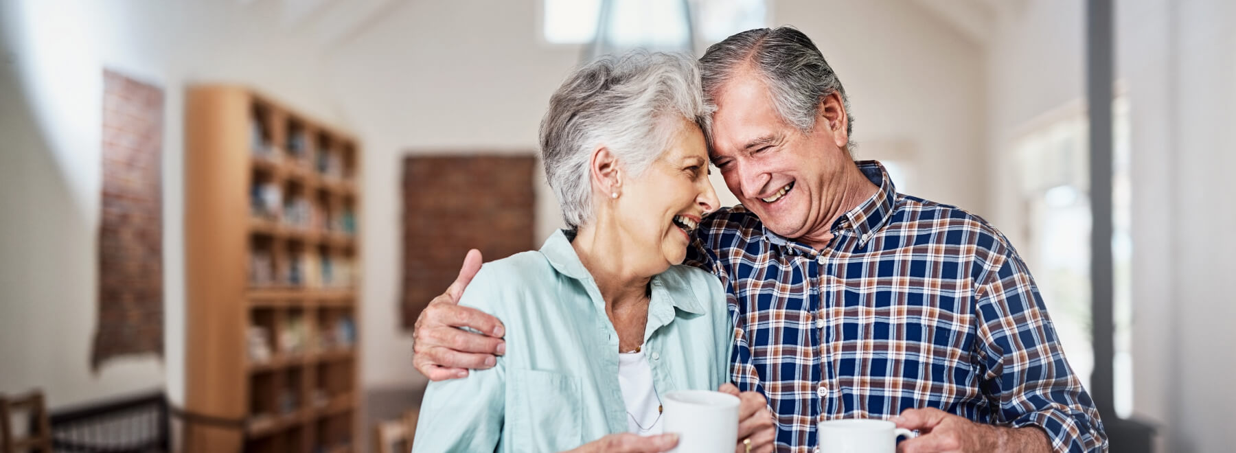 Mature couple smiling and hugging